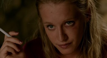 Movie still from “Swimming Pool” (2003), directed by François Ozon – A woman's face with green eyes; Close Up shot, Low angle