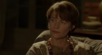 Movie still from “Swimming Pool” (2003), directed by François Ozon – A person wearing a necklace; Close Up shot, Over the shoulder angle