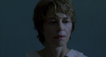 Movie still from “Swimming Pool” (2003), directed by François Ozon – A person with short hair; Close Up shot, Low angle