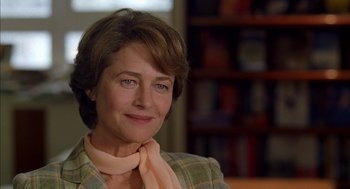 Movie still from “Swimming Pool” (2003), directed by François Ozon – A person wearing a scarf; Close Up shot, Over the shoulder angle