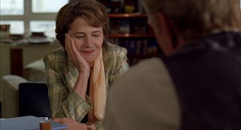 Movie still from “Swimming Pool” (2003), directed by François Ozon – An older woman sitting in front of an older man; Close Up shot, Over the shoulder angle