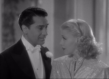 Movie still from “Swing Time” (1936), directed by George Stevens – A man and a woman standing next to each other; Close Up shot, Low angle