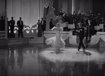 Movie still from “Swing Time” (1936), directed by George Stevens – A man and a woman are dancing in a ballroom; Extreme Wide shot, High angle