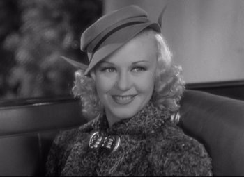 Movie still from “Swing Time” (1936), directed by George Stevens – A black and white photo of a woman wearing a hat; Close Up shot, High angle
