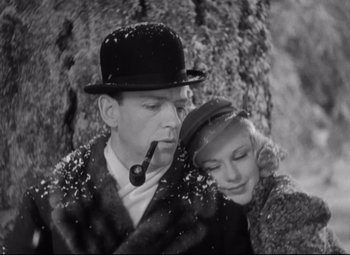 Movie still from “Swing Time” (1936), directed by George Stevens – A man and a woman snuggling under a tree; Close Up shot, High angle