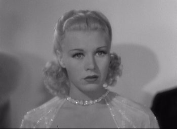 Movie still from “Swing Time” (1936), directed by George Stevens – A black - and - white photo of a woman in a dress; Close Up shot, Low angle