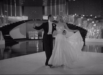 Movie still from “Swing Time” (1936), directed by George Stevens – A man and a woman dancing in a ballroom; Wide shot, Low angle