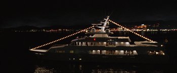 Movie still from “Syriana” (2005), directed by Stephen Gaghan – A large boat in a body of water at night; Extreme Wide shot, High angle