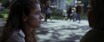 Movie still from “Syriana” (2005), directed by Stephen Gaghan – A person looking at a group of people; Close Up shot, Over the shoulder angle
