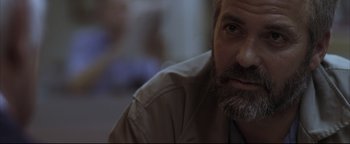 Movie still from “Syriana” (2005), directed by Stephen Gaghan – A person with a beard; Close Up shot, Over the shoulder angle