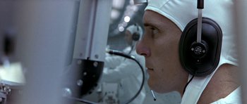 Movie still from “THX 1138” (1971), directed by George Lucas – A person wearing a helmet; Close Up shot, Low angle