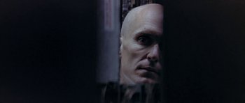 Movie still from “THX 1138” (1971), directed by George Lucas – A man with a bald head looking into a mirror; Close Up shot, Low angle
