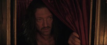 Movie still from “Tale of Tales” (2015), directed by Matteo Garrone – A person holding a curtain; Close Up shot, Over the shoulder angle
