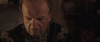 Movie still from “Tale of Tales” (2015), directed by Matteo Garrone – An older man is looking down at his face; Close Up shot, Over the shoulder angle