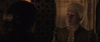 Movie still from “Tale of Tales” (2015), directed by Matteo Garrone – A man with blonde hair is looking into a mirror; Close Up shot, Over the shoulder angle