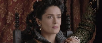 Movie still from “Tale of Tales” (2015), directed by Matteo Garrone – A person holding a cell phone; Close Up shot, Over the shoulder angle