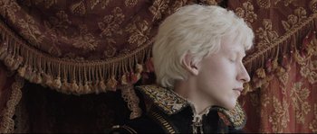 Movie still from “Tale of Tales” (2015), directed by Matteo Garrone – A person's face with white hair; Close Up shot, Low angle