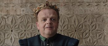 Movie still from “Tale of Tales” (2015), directed by Matteo Garrone – A person wearing a crown; Close Up shot, High angle