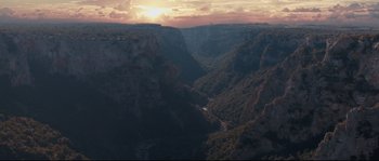 Movie still from “Tale of Tales” (2015), directed by Matteo Garrone – A view of a valley with a sunset in the background; Extreme Wide shot, High angle
