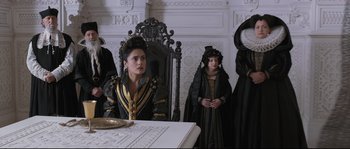 Movie still from “Tale of Tales” (2015), directed by Matteo Garrone – A group of people dressed in medieval clothing; Medium shot, Over the shoulder angle