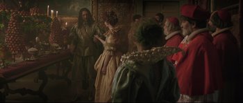Movie still from “Tale of Tales” (2015), directed by Matteo Garrone – A group of people dressed in renaissance costumes; Wide shot, Over the shoulder angle