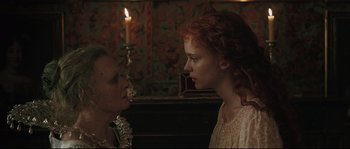 Movie still from “Tale of Tales” (2015), directed by Matteo Garrone – Two people standing next to each other near a candle; Close Up shot, Over the shoulder angle