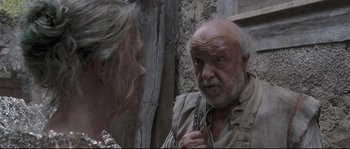 Movie still from “Tale of Tales” (2015), directed by Matteo Garrone – An old man and a woman talking to each other; Medium shot, Over the shoulder angle