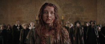 Movie still from “Tale of Tales” (2015), directed by Matteo Garrone – A woman with blood all over her face and neck; Close Up shot, Low angle