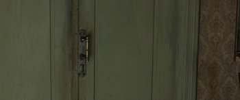 Movie still from “Tangerines” (2013), directed by Zaza Urushadze – A door handle on a green door; Extreme Close Up shot, High angle