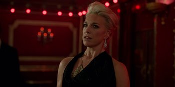 Movie still from “Ted Lasso” (2020), created by Brendan Hunt – A woman with blonde hair wearing a black dress; Close Up shot, Over the shoulder angle