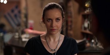 Movie still from “Ted Lasso” (2020), created by Brendan Hunt – A person wearing a black shirt; Close Up shot, Over the shoulder angle