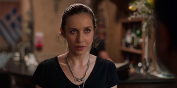 Movie still from “Ted Lasso” (2020), created by Brendan Hunt – A person wearing a black shirt; Close Up shot, Over the shoulder angle