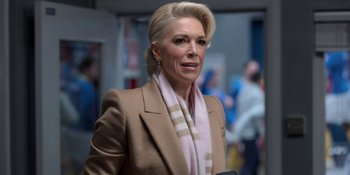 Movie still from “Ted Lasso” (2020), created by Brendan Hunt – A woman with blonde hair wearing a brown jacket; Close Up shot, Over the shoulder angle