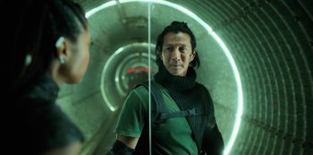 Movie still from “Altered Carbon” (2018), created by Laeta Kalogridis – A man standing in front of a mirror in a tunnel; Close Up shot, Low angle