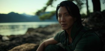 Movie still from “Altered Carbon” (2018), created by Laeta Kalogridis – A person near a body of water; Close Up shot, High angle