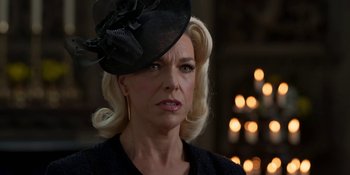 Movie still from “Ted Lasso” (2020), created by Brendan Hunt – A person wearing a hat; Close Up shot, Over the shoulder angle