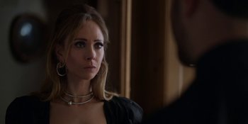 Movie still from “Ted Lasso” (2020), created by Brendan Hunt – A woman wearing a black dress looking at the camera; Close Up shot, Over the shoulder angle