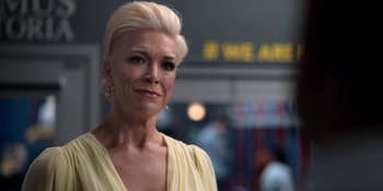 Movie still from “Ted Lasso” (2020), created by Brendan Hunt – A person wearing a yellow dress; Close Up shot, Over the shoulder angle