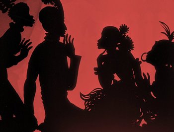 Movie still from “The Adventures of Prince Achmed” (1926), directed by Lotte Reiniger – A shadow of a man and a woman on a red background; Extreme Close Up shot, Low angle