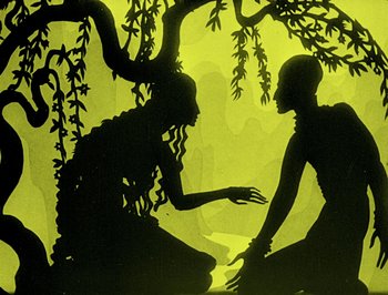 Movie still from “The Adventures of Prince Achmed” (1926), directed by Lotte Reiniger – A shadow of a woman and a man sitting under a tree; Medium shot, Low angle