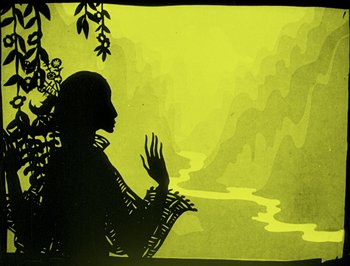 Movie still from “The Adventures of Prince Achmed” (1926), directed by Lotte Reiniger – A silhouette of a person standing next to a body of water; Close Up shot, Low angle