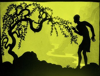 Movie still from “The Adventures of Prince Achmed” (1926), directed by Lotte Reiniger – A silhouette of a man running next to a tree; Wide shot, Low angle