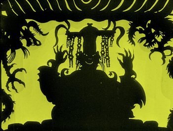 Movie still from “The Adventures of Prince Achmed” (1926), directed by Lotte Reiniger – A silhouette of a person in a yellow background; Wide shot, Low angle