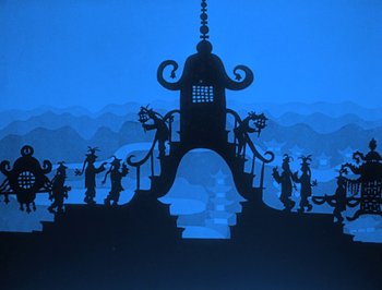 Movie still from “The Adventures of Prince Achmed” (1926), directed by Lotte Reiniger – A silhouette painting of a castle and people on a hill; Extreme Wide shot, Low angle