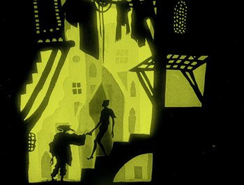 Movie still from “The Adventures of Prince Achmed” (1926), directed by Lotte Reiniger – A shadowed scene of a man and a woman holding hands; Wide shot, Low angle