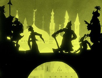 Movie still from “The Adventures of Prince Achmed” (1926), directed by Lotte Reiniger – A group of silhouetted people standing on top of a bridge; Wide shot, Low angle
