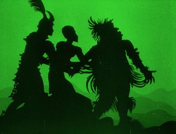 Movie still from “The Adventures of Prince Achmed” (1926), directed by Lotte Reiniger – A group of people standing next to each other on top of a hill; Wide shot, Low angle