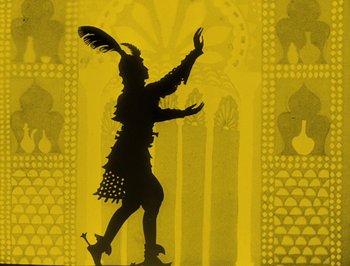 Movie still from “The Adventures of Prince Achmed” (1926), directed by Lotte Reiniger – A silhouette of a man with a feather in his hat; Medium shot, Low angle
