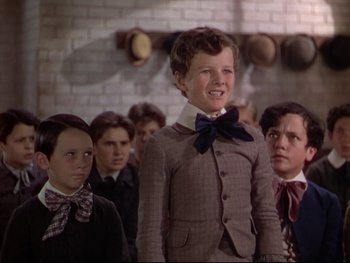 Movie still from “The Adventures of Tom Sawyer” (1938), directed by Norman Taurog – A group of young men standing next to each other; Medium shot, Low angle
