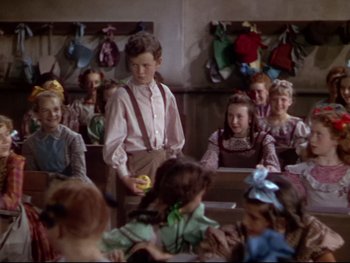 Movie still from “The Adventures of Tom Sawyer” (1938), directed by Norman Taurog – A group of children sitting in a classroom; Medium shot, High angle